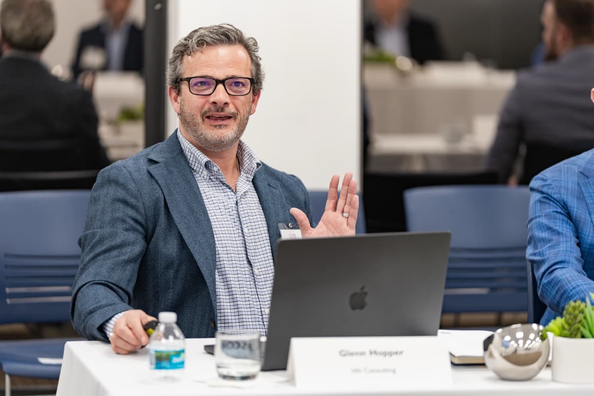 Glenn Hopper leading a roundtable discussion on AI strategy for CFOs at a G3 Consulting event